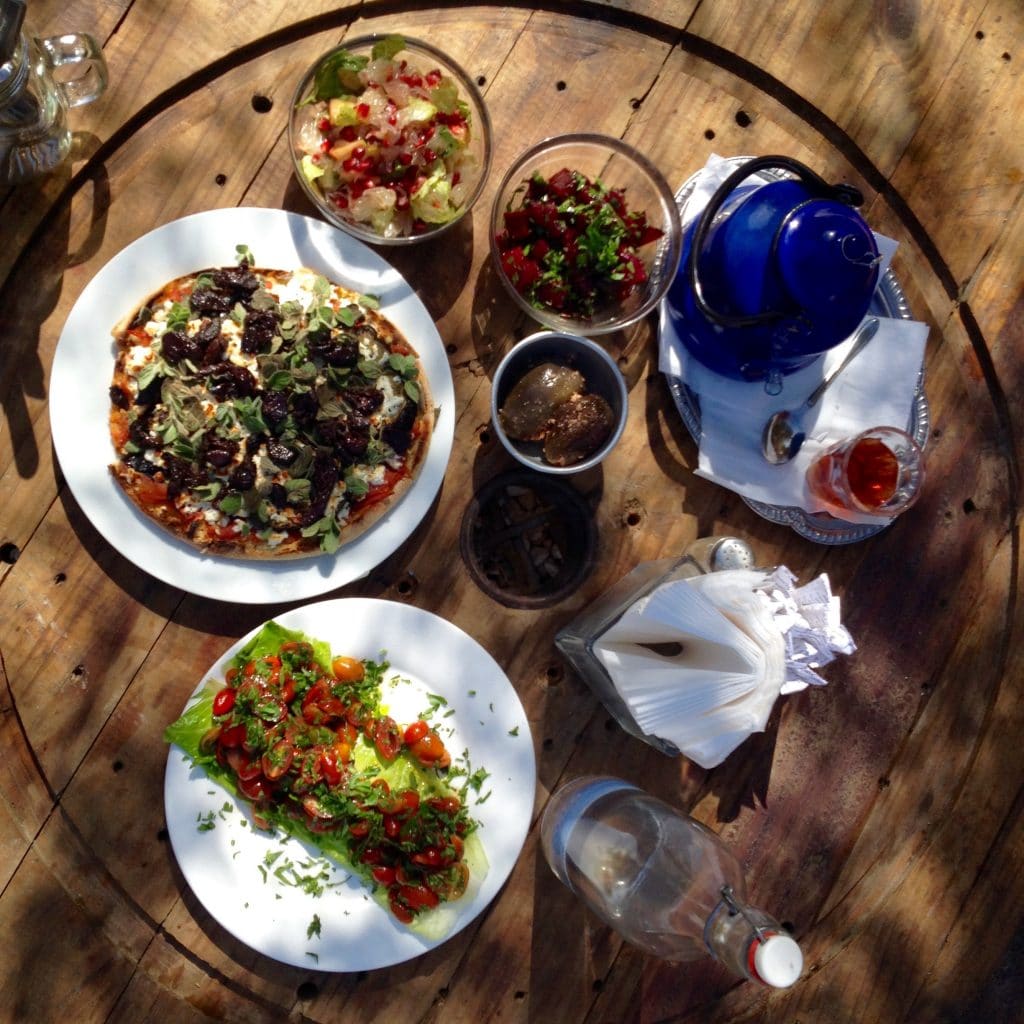 Salads: Pomelo and pomegranate, Beet, Cheery tomato; Chai; Manakish with cheese, olives and eggplant; Makdous