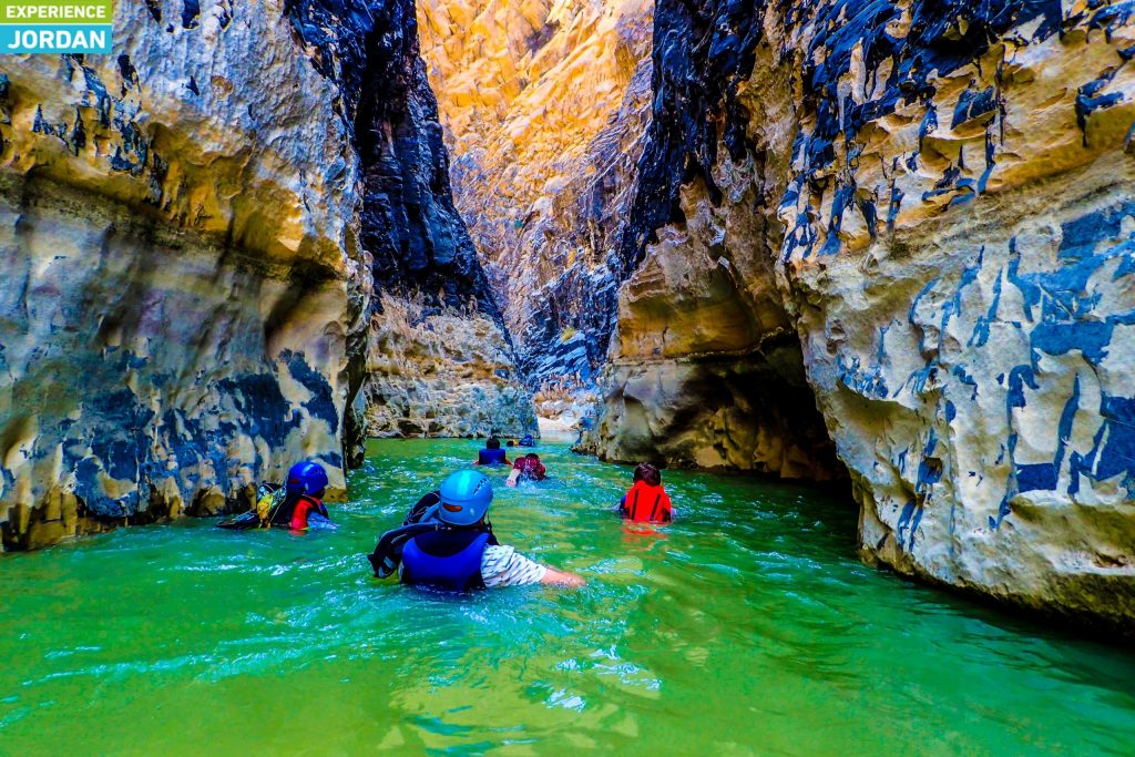 Wading through the canyon pools of Wadi Mujib