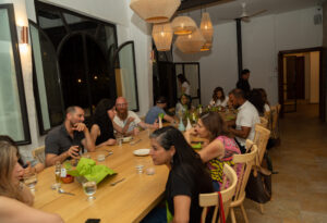 Carob House Full Table with People